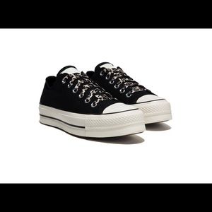 Never worn Converse - platform, black with cheetah laces.